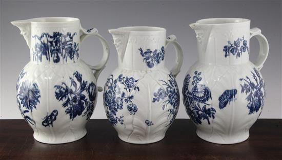 Three Worcester blue and white cabbage leaf moulded mask jugs, c.1770-80, 8.5in. - 9.25in., two cracked